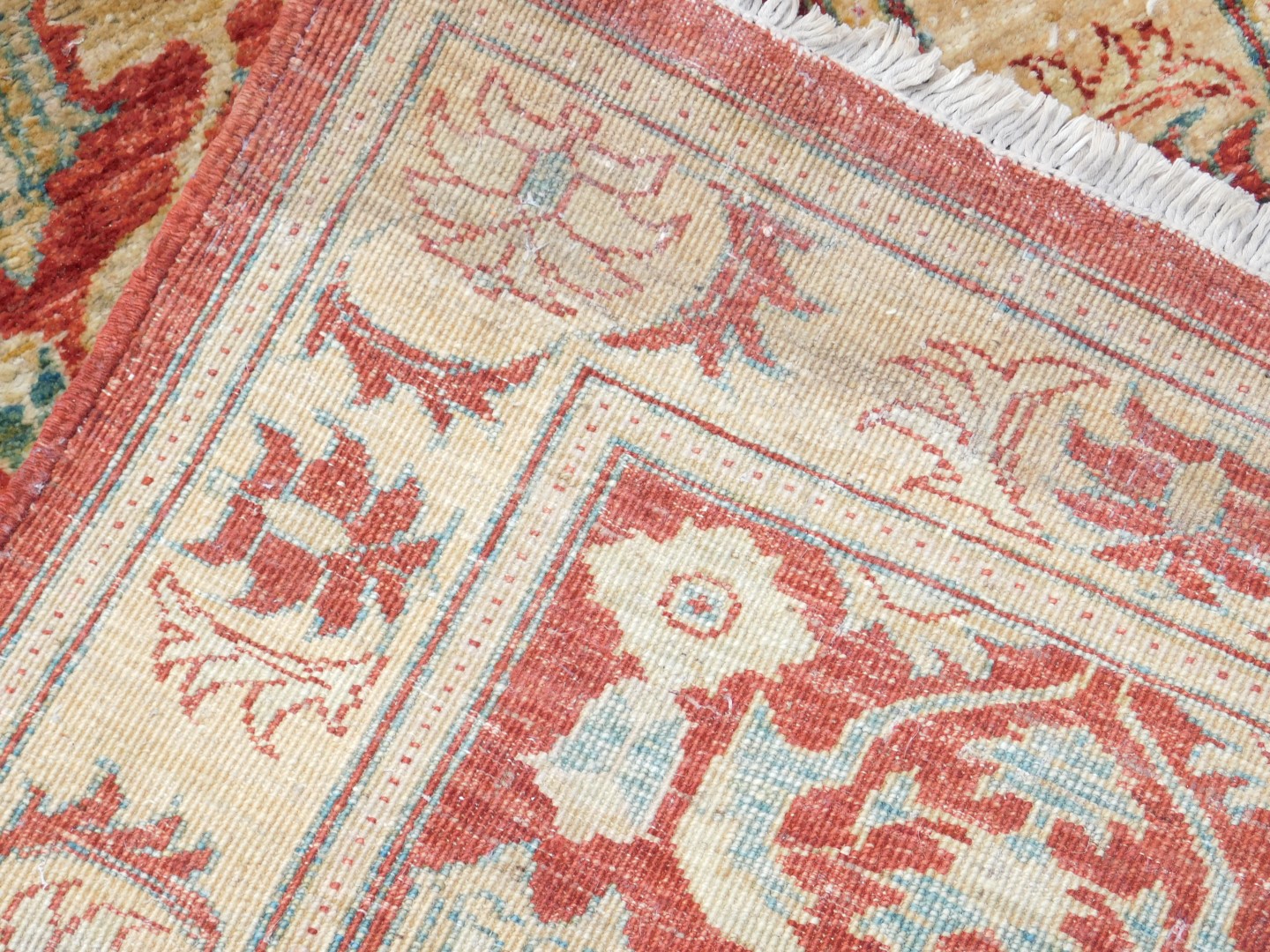 An Afghan red ground runner, decorated with repeating floral medallions and motifs, within repeating - Image 3 of 3