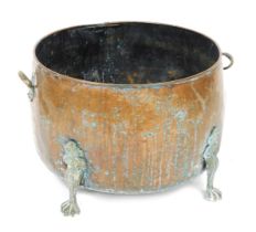 A late Victorian copper and brass log bucket, with twin handles, raised on four claw feet, 55cm wide