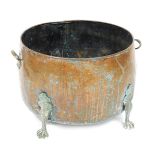 A late Victorian copper and brass log bucket, with twin handles, raised on four claw feet, 55cm wide