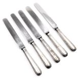 A set of five George V silver handled table knives, with stainless steel blades, by James Deakin & S