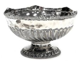 A Victorian silver pedestal bowl, of semi fluted form, with a shell capped, gadrooned rim, Atkin Bro