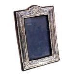 An Elizabeth II silver strut photograph frame, embossed with bows and swags, London 1970, 19.5cm x 1