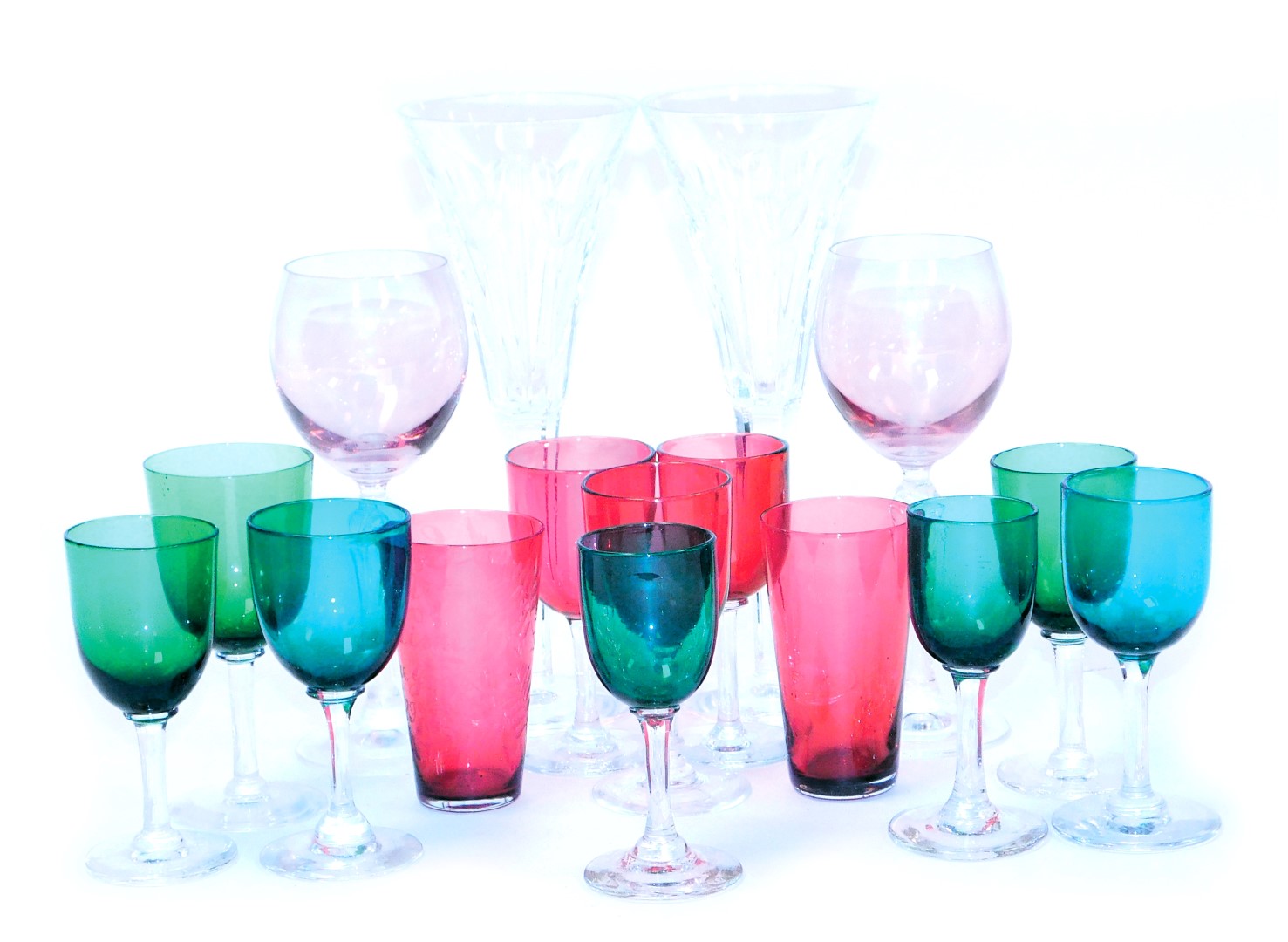 A group of early 20thC green, turquoise and cranberry wine glasses, pair of Waterford cut glass cham