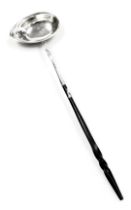 A Georgian silver plated toddy ladle, monogram engraved, with a whale bone handle, 32cm wide.