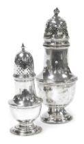 An Elizabeth II silver sugar sifter, of baluster form, Birmingham 1958, and a further Victorian silv