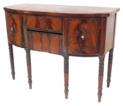 A George III mahogany bowfront sideboard, with cellaret drawer, central frieze drawer and concealed