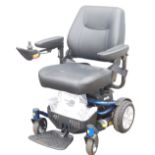 A Roma Medical Reno Elite powerchair, model P325, with battery and instructions.