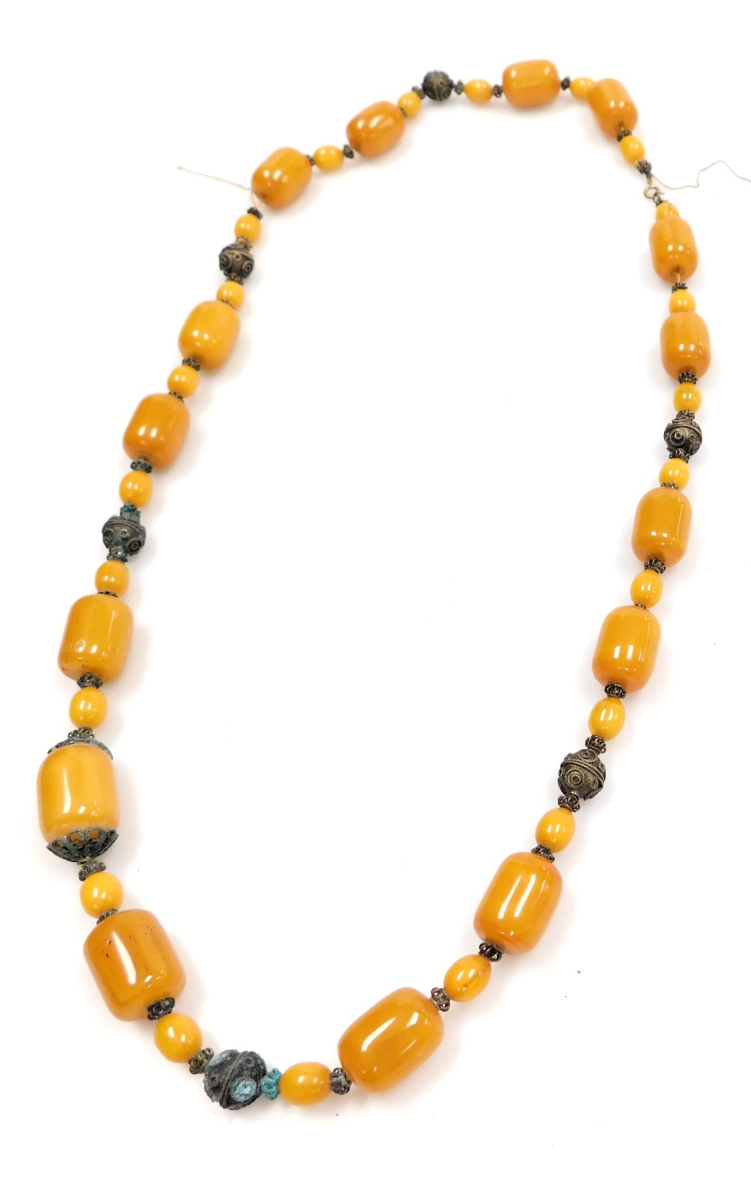 A string of butterscotch amber coloured beads, interspersed with metal links, 183.2g all in.