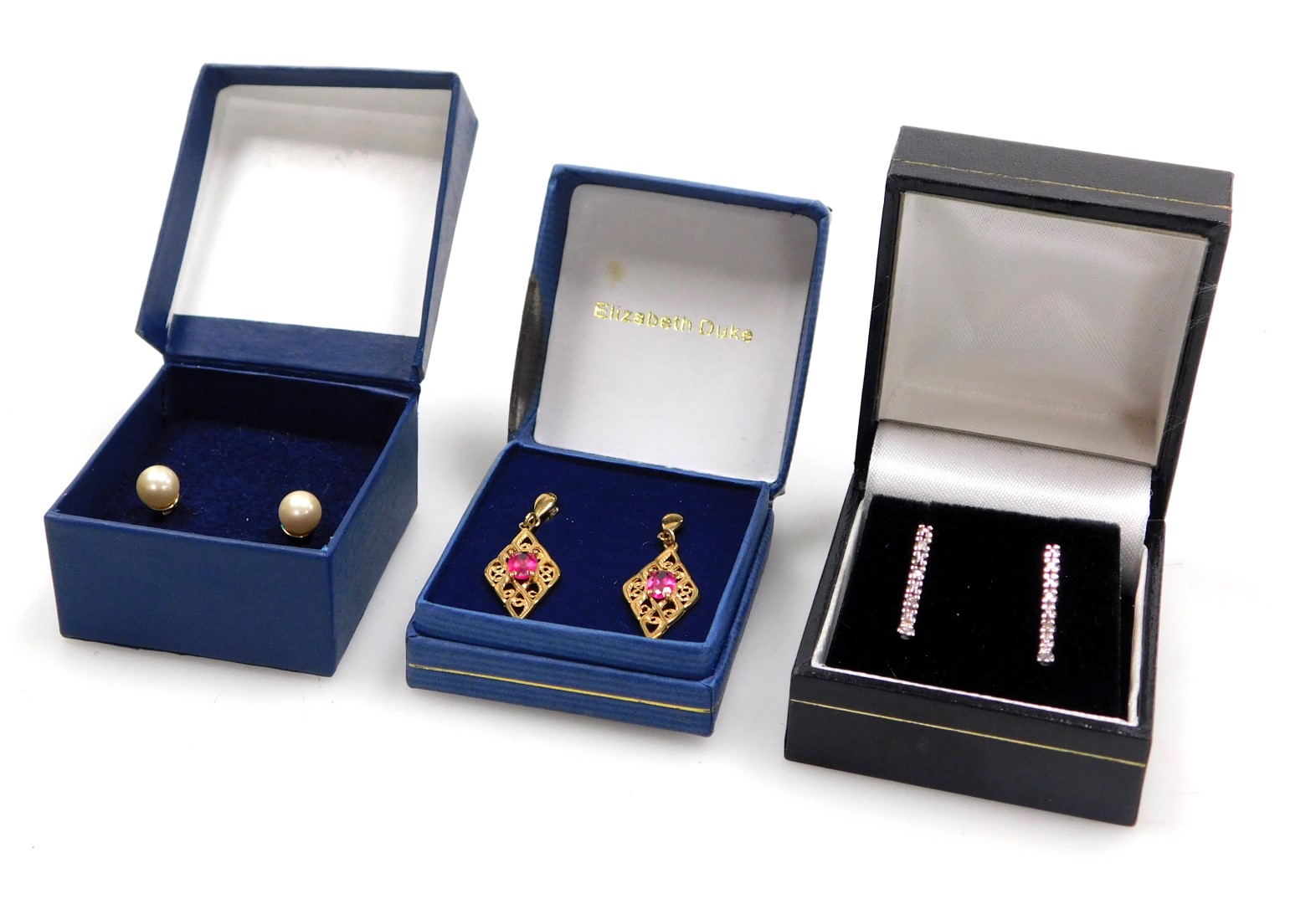 A pair of 9ct gold and pink stone earrings, in a pierced, lozenge shaped design, pair of drop earrin