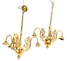 A pair of brass three branch chandeliers, with foliate scroll arm brackets, 54cm high.