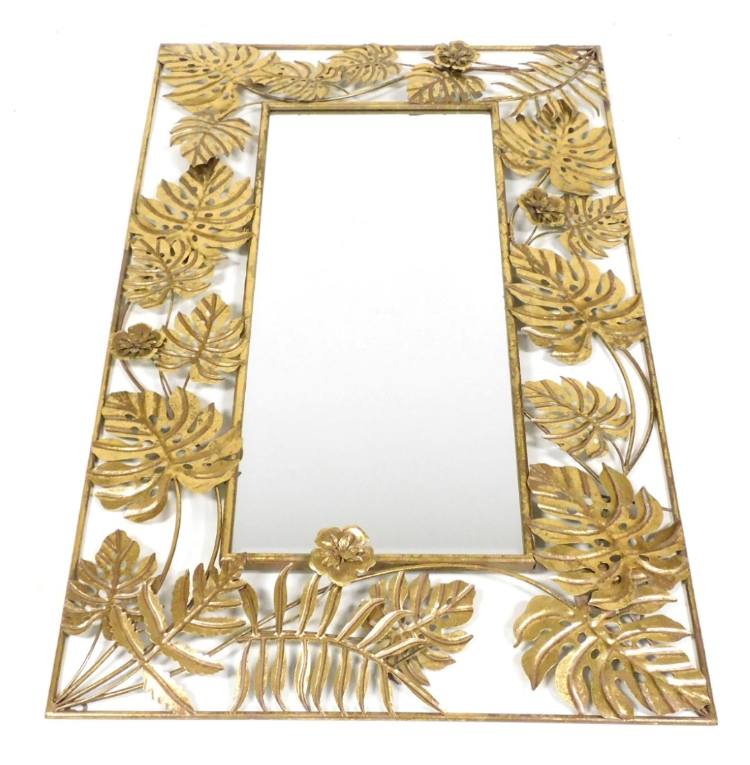 A late 20thC gilt metal rectangular wall mirror, inset bevelled glass, within a frame of scrolling l