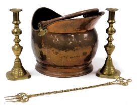 A Victorian copper helmet shaped coal scuttle, 35cm wide, pair of brass candlesticks, 27cm high, and