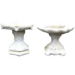 A concrete birdbath, of hexagonal form, raised on an out swept stem with foliate decoration, 41cm wi