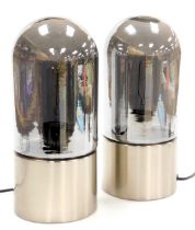 A pair of silvered glass and metal table lamps, of domed, bullet form, 33cm high.