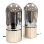 A pair of silvered glass and metal table lamps, of domed, bullet form, 33cm high.