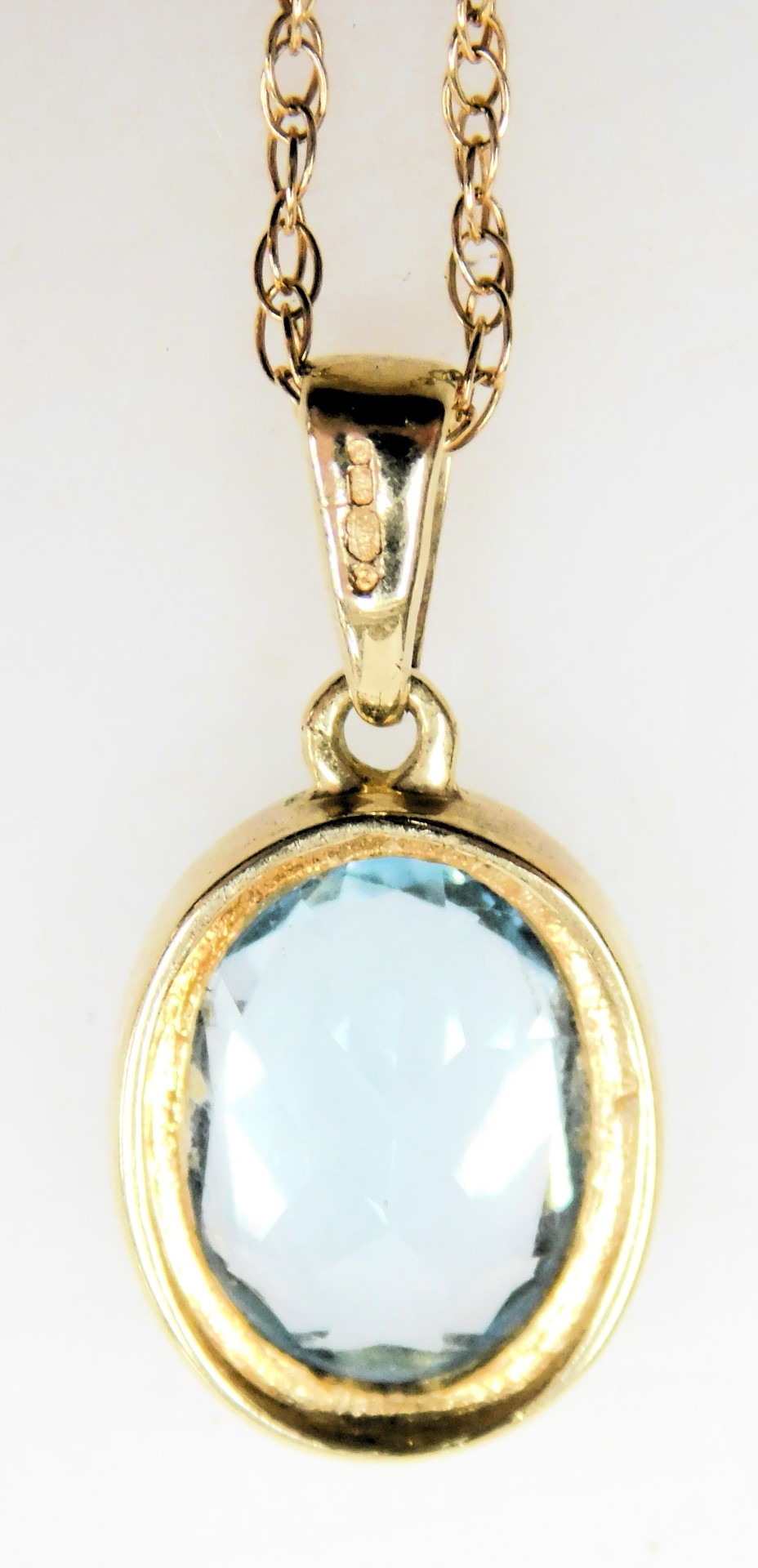 A 9ct gold and aquamarine pendant, in an oval setting, on a fine neckchain, with a bolt ring clasp, - Image 4 of 4