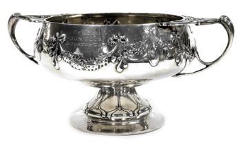 An Edward VII silver twin handled pedestal bowl, Lee Hendon Gun Club Scratch Cup, embossed with bow