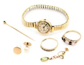 A Record lady's 9ct gold cased wristwatch, circular champagne dial bearing Arabic numerals, on a pla