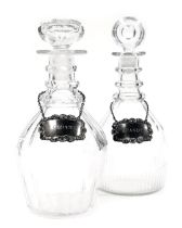 A Victorian cut glass three ringed decanter, and stopper, with a silver Claret label, and a further