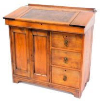 A Victorian pine clerk's desk, the leather inset hinged lid, opening to reveal a vacant interior, ab