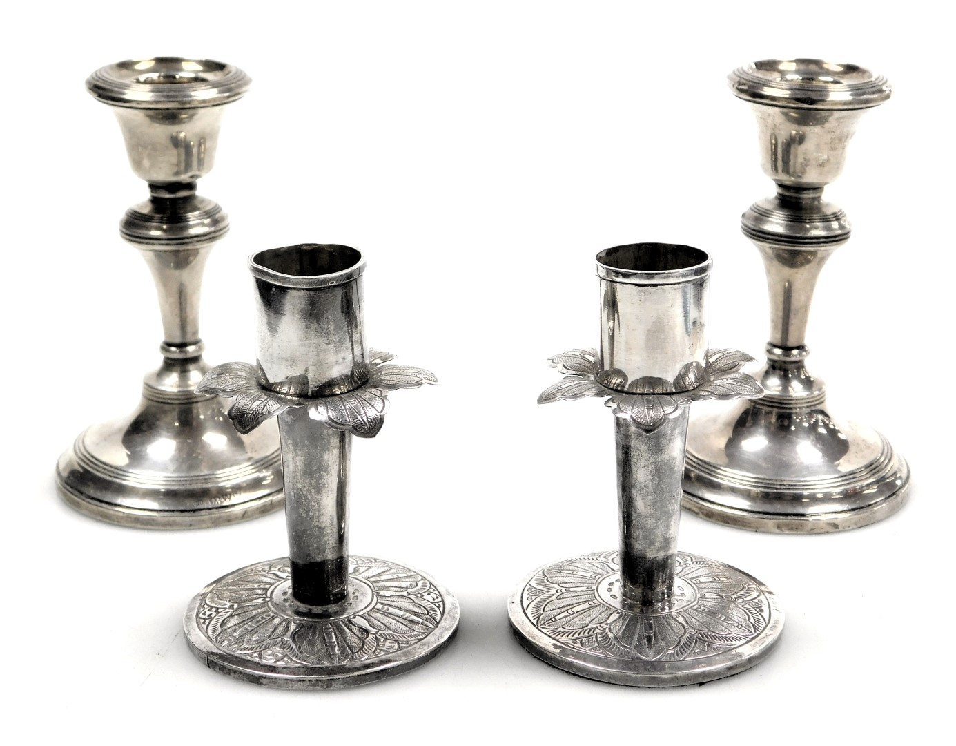 A pair of George V loaded silver candlesticks, Chester 1913, 5.85oz all in, 9.5cm high, together wit