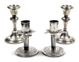 A pair of George V loaded silver candlesticks, Chester 1913, 5.85oz all in, 9.5cm high, together wit