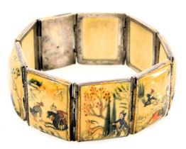 An early 20thC Indian lacquered bone bracelet, of eight panels, painted with hunting and pastoral sc