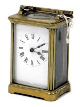 An early 20thC brass cased carriage clock, rectangular enamel dial bearing Roman numerals, single ba