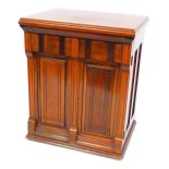 A Victorian mahogany sewing cabinet, containing a Jones Family C.S treadle sewing machine, 77cm high