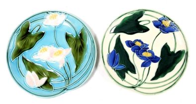 A pair of late 19thC Villeroy & Boch majolica dishes, decorated with flowers, one against a cream gr