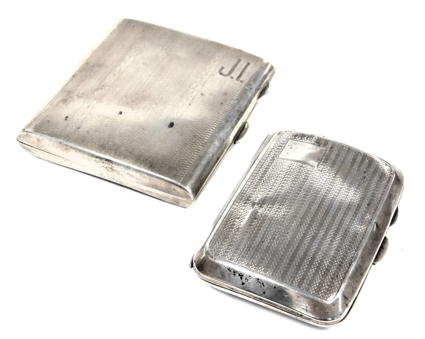 A George V silver cigarette case, with engine turned decoration, engraved finely with initials JI, B