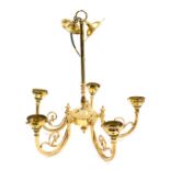 A brass five branch chandelier, the arms with scrolling foliate detailing, 47cm high.