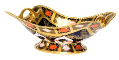 A Royal Crown Derby Imari gold ground porcelain basket, of twin handled, footed form, pattern no. 11