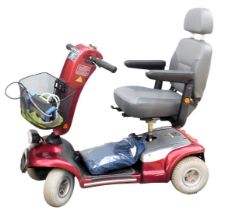 A Sterling Sapphire mobility scooter, red chassis, with battery and key.