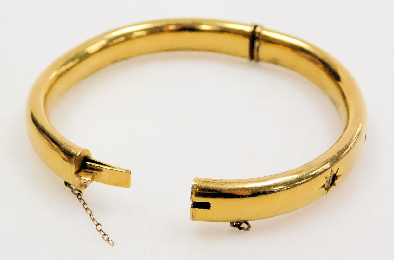 A seed pearl and emerald set bangle, one pearl lacking, in yellow metal, on a snap clasp, with safet - Image 2 of 2