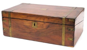 A Victorian mahogany and brass bound writing slope, with a fitted interior, with key, 45cm wide, 25.