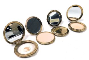 Four Stratton and other compacts, including one with a mother of pearl and musical score finish, and