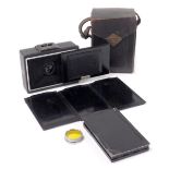 A vintage Ihagee folding camera, with plates, cased.