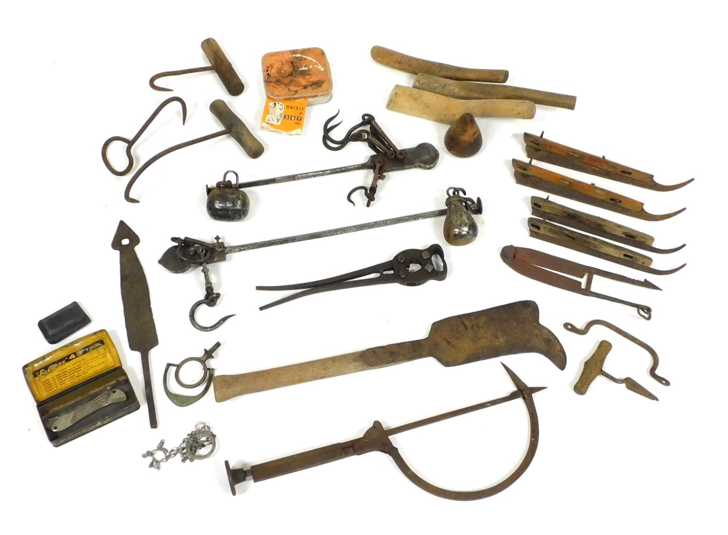 Assorted vintage tools, including a thatcher's needle, vintage wire cutters, cast iron sliding scale