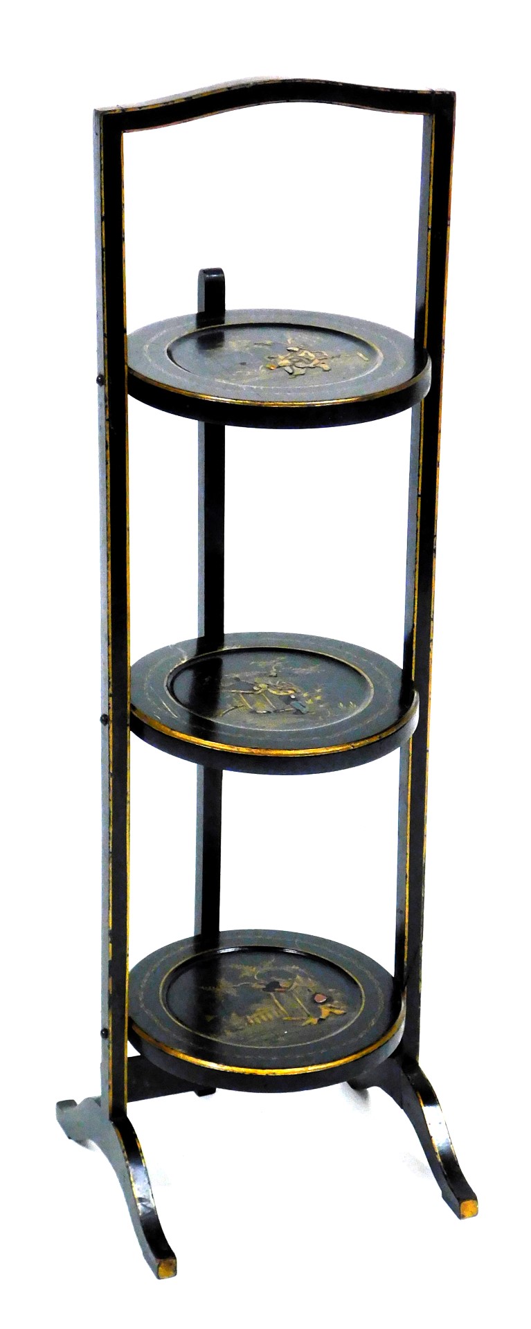 A late Victorian Japanese lacquer three tier folding cake stand, decorated with figures in a garden