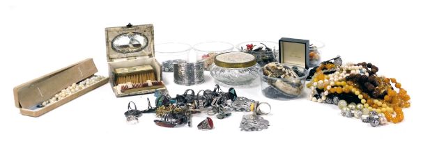 A group of silver and costume jewellery, including American silver rings, paste and other brooches,