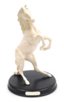 A Beswick matt white pottery figure of Spirit of the Wild, raised on a named circular base, 31cm hig