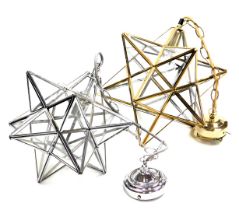 Two metal framed tetrahedron star shaped ceiling lights, 31cm and 27cm high.