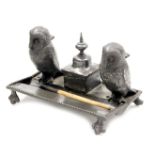 A late 19thC novelty desk stand, with twin owl inkwells and pen recess, on a rectangular base, and f