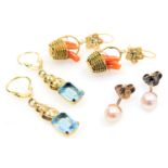 A pair of aquamarine drop earrings, in yellow metal, pair of coral earrings in a basket setting, and