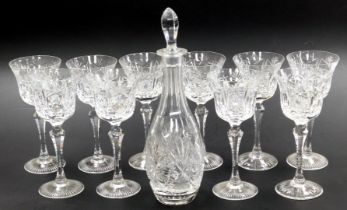A set of ten Continental cut glass stemmed wine glasses, together with a cut glass decanter and stop
