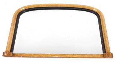 A Victorian light oak and ebonised over mantle mirror, 68cm x 105cm.