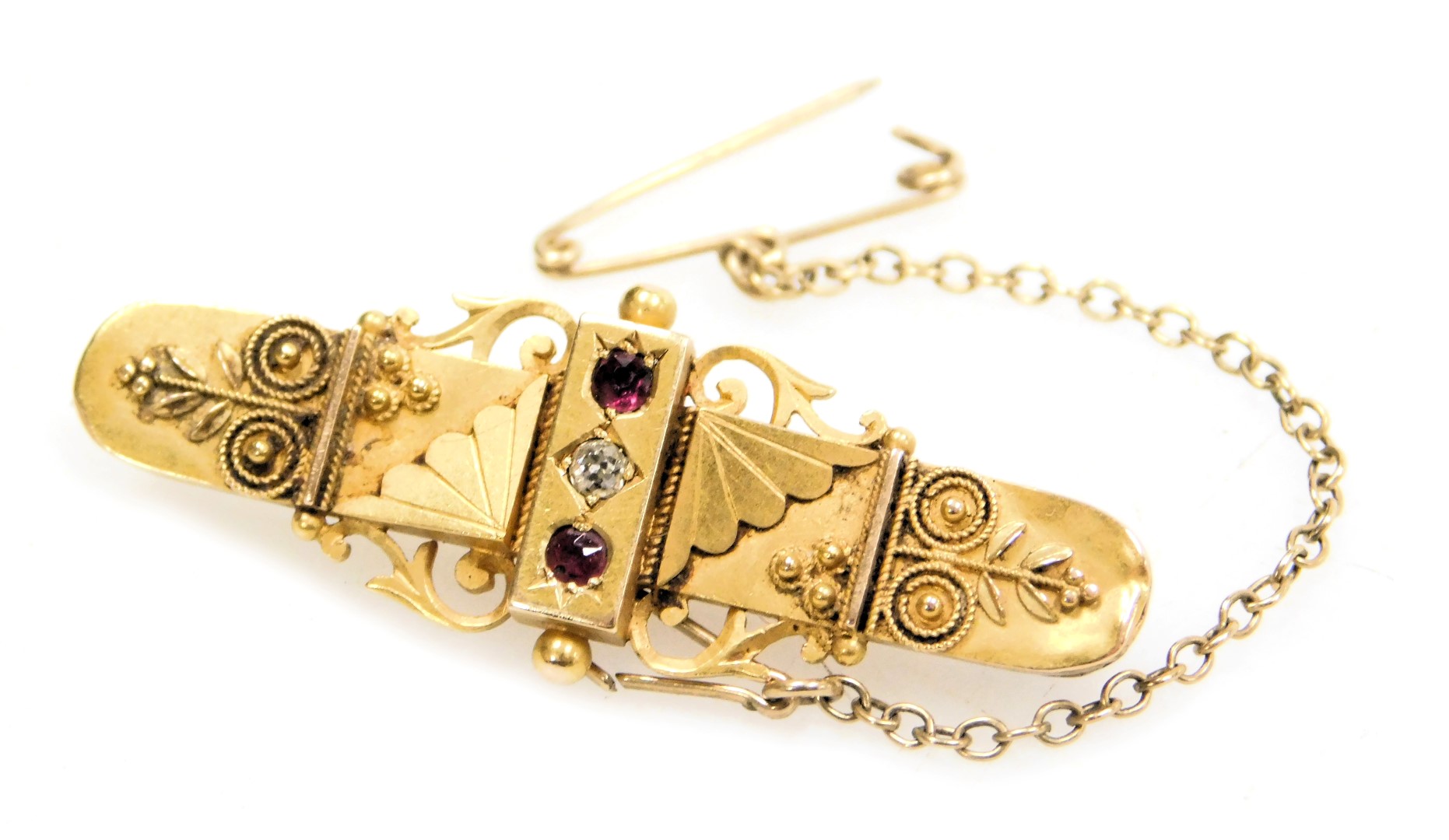 A Victorian Etruscan Revival 15ct gold ruby and diamond brooch, with safety pin, 4.0g.