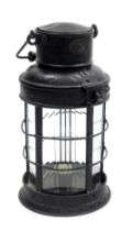 A late 19thC Eli Griffiths black metal railway lantern, bears oval plaque, 34cm high.