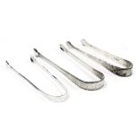 Three George III silver sugar tongs, with engraved decoration, 2.22oz.